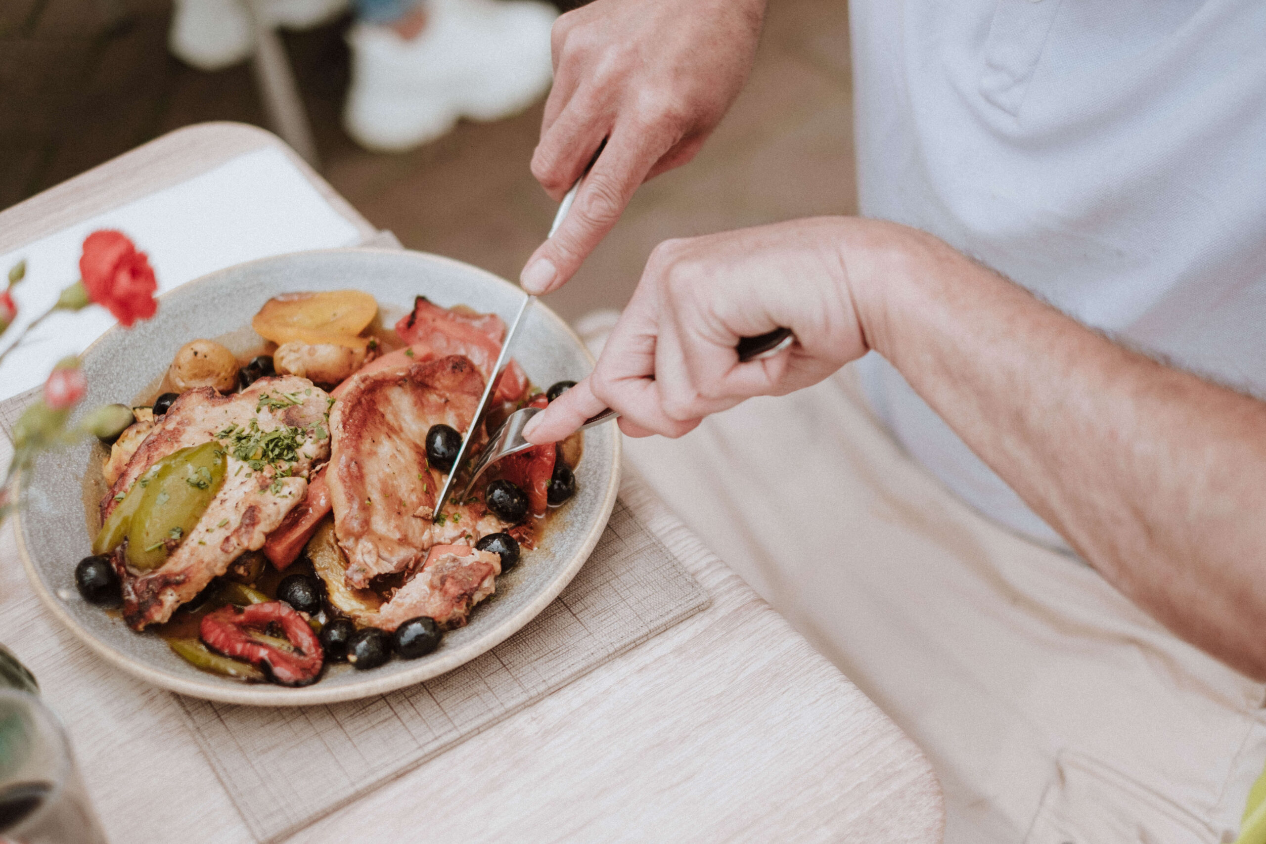 Guests eating together at Amalfi's outside tables on Hythe High Street